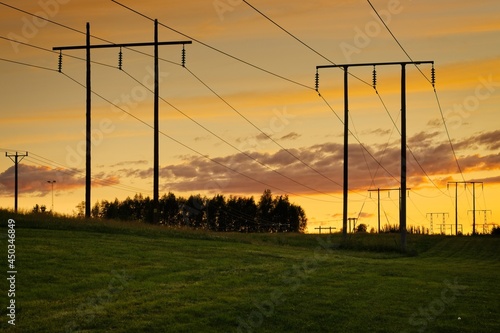 Obraz na plátně High-voltage power lines and pylons just after sunset