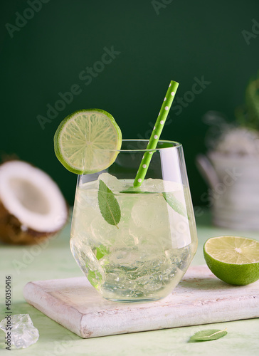 Cocktail or mocktail coconut lime and herbal tea.