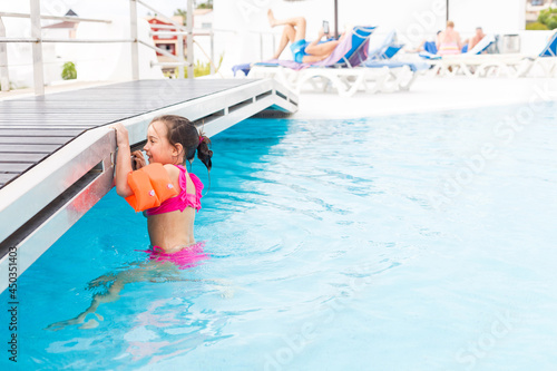 happy girl in the swimming in swimming suit