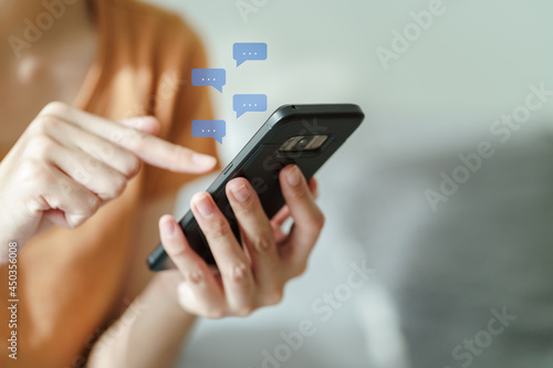 Young Asian woman using smartphone typing, chatting conversation . Social Network, technology concept