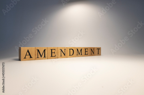 Amendment was created from wooden cubes. News and journalism concepts.
