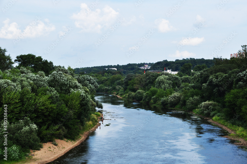 Panoramic view of the Dnieper River and the banks overgrown with forest. River and coastline. Smolensk, Russia.