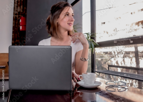Business woman working  on laptop or computer