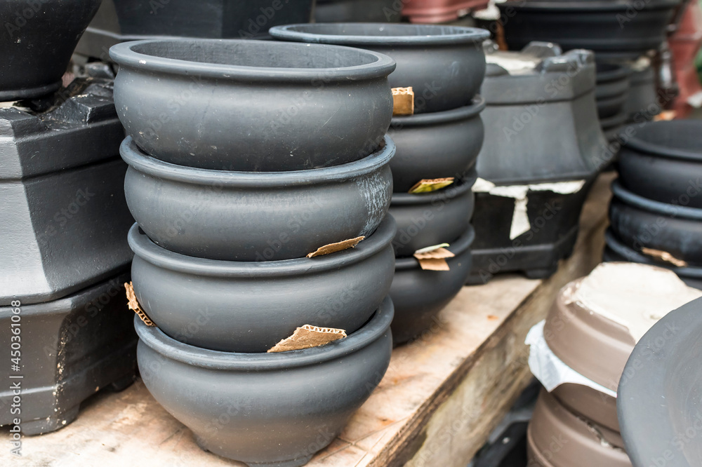 Various painted Terracotta clay pots for sale at a garden supplies