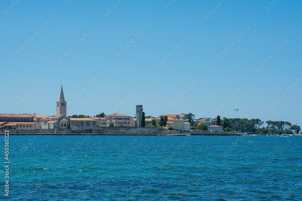 The historic medieval coastal town of Porec in Istria, Croatia, seen from the shore just north of the old town
