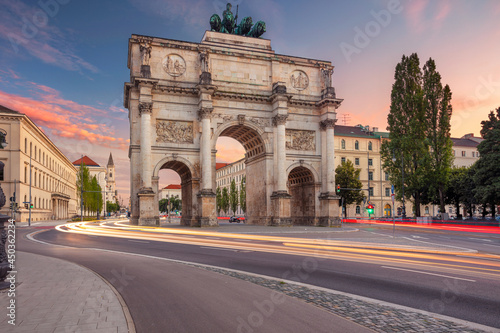 Munich, Germany. Cityscape image of Munich, Bavaria, Germany with the Siegestor at summer sunset. photo