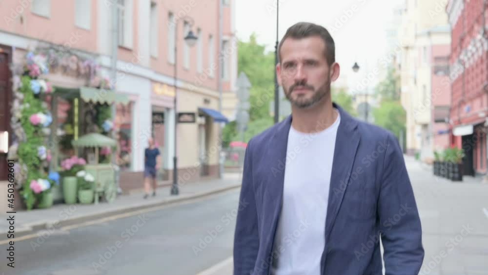Close up of Man Walking in Empty Street, Slow Motion Close up of Man Walking in Empty Street, Slow Motion