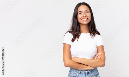 pretty thin hispanic woman looking like a happy, proud and satisfied