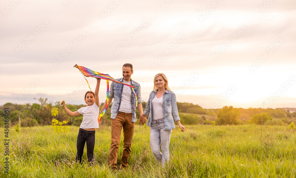 Young happy family in a field Young happy family in a field