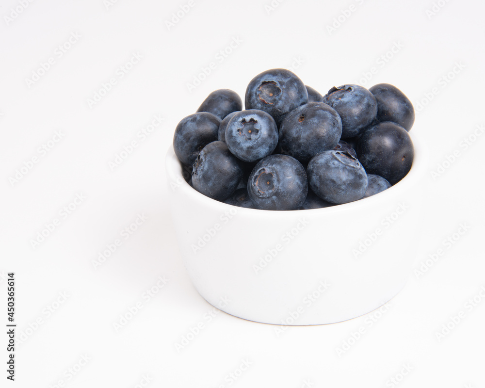 Fresh blueberry in white dish on the white background Fresh blueberry in white dish on the white background