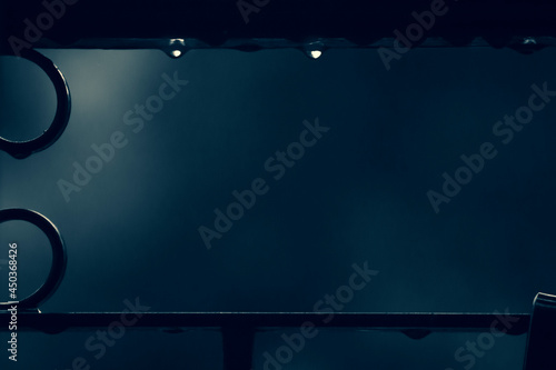 water drop hanging from a railing