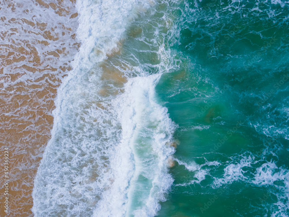 Aerial view of drone. Scene of top view beach and seawater on sandy beach in summer. Nature and travel concept.