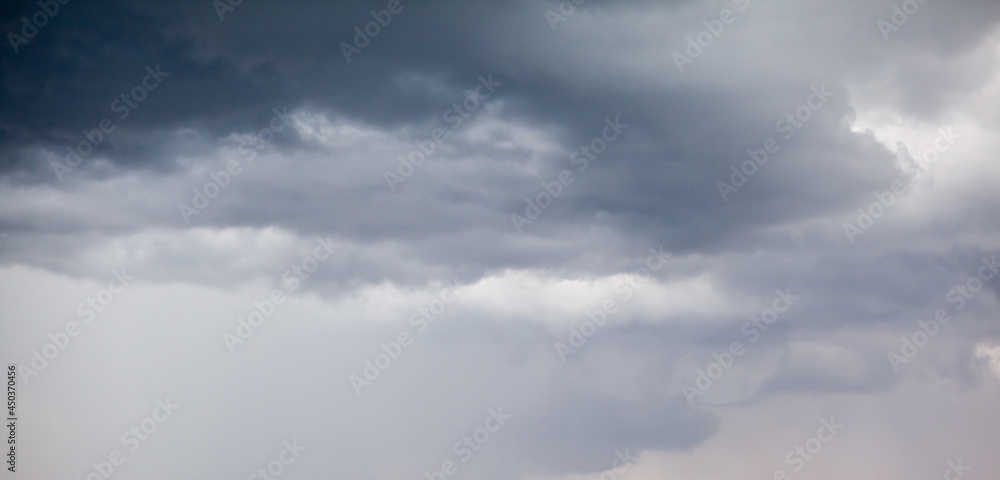 Dramatic sky with grey clouds over the city before the storm. Weather before or after a storm. Dramatic sky with grey clouds over the city before the storm. Weather before or after a storm.