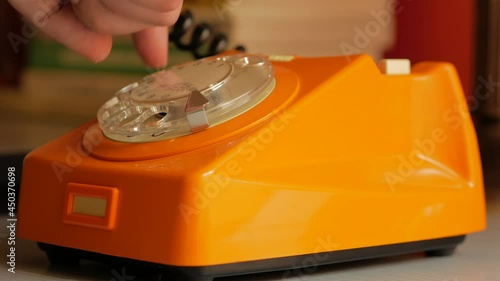 Making a phone call on an old rotary telephone