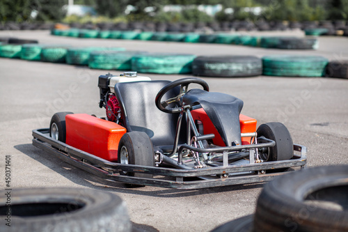 A go-karting car is standing on the highway and waiting for the driver. Go-karting cars for children and adults.