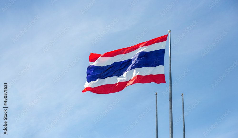 Thai flag on sky windy day for asia national sign