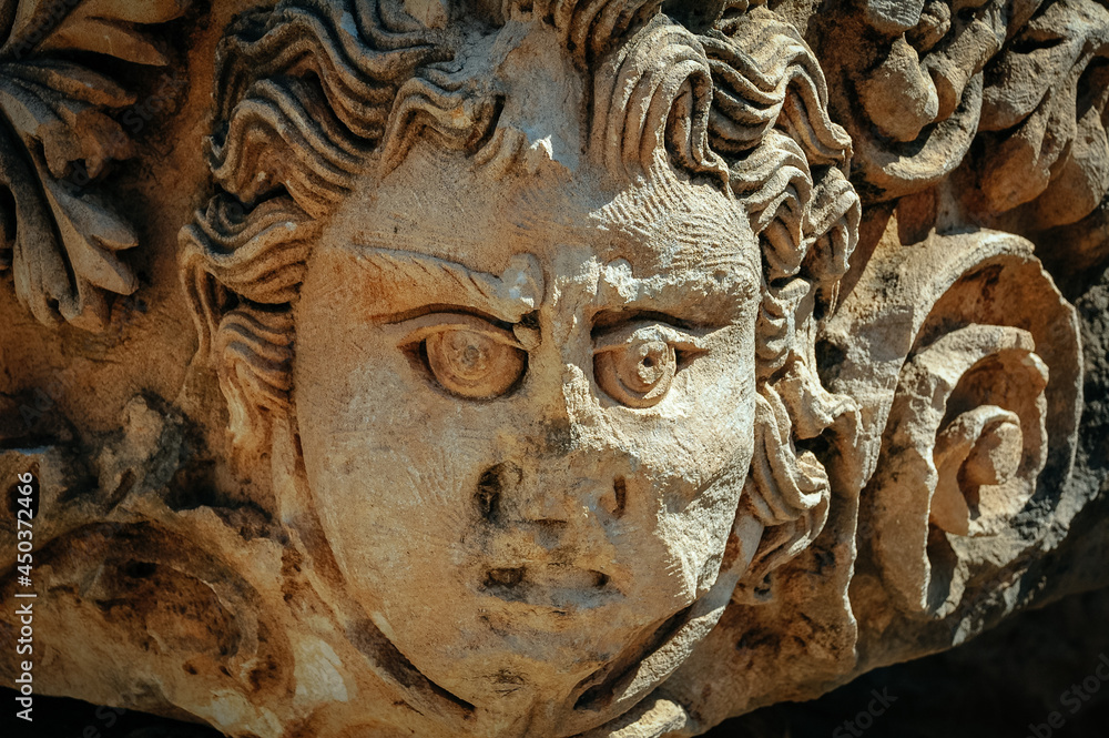 Sculpture in stone. Face on the stone Demre Turkey