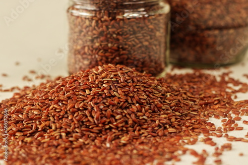 Navara rice is one of the many types of rice found in India, with a unique red color.. photo