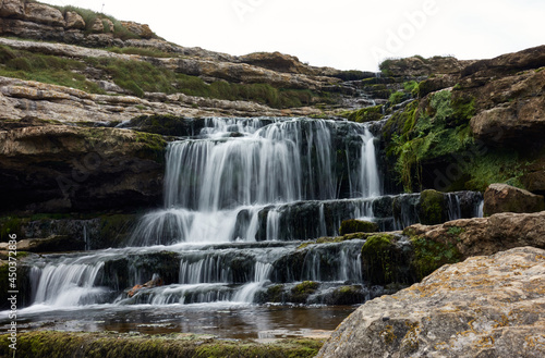 Fototapeta Naklejka Na Ścianę i Meble -  silk effect in small river waterfall