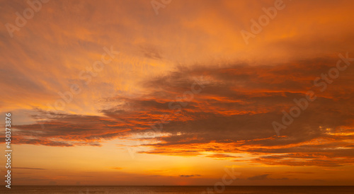 Scene of Sunset close up the sun. Colorful romantic sky sunset with Moving clouds background. time lapse day to night in nature and travel concept. © BUDDEE