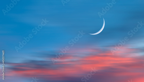 Abstract background with Crescent moon over the sunset clouds