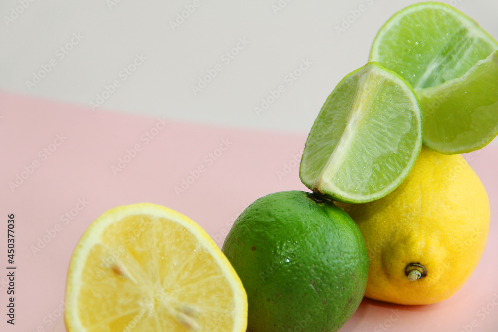 lemon, lime and juicy lime slices on a bright background