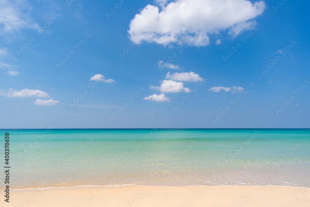 beach with blue sky and clouds