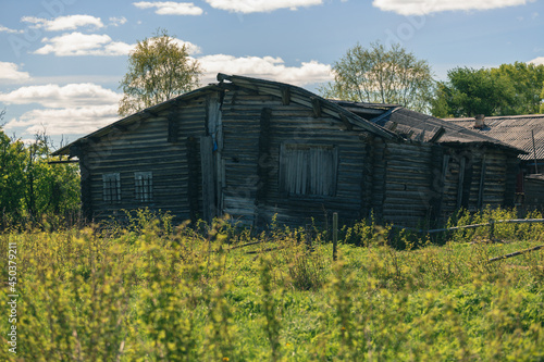 An old one-story uninhabited village house made of wood is gradually being destroyed from time to time
