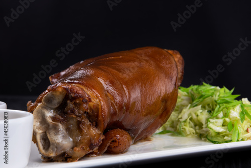 Tasty pork knuckle with sau...