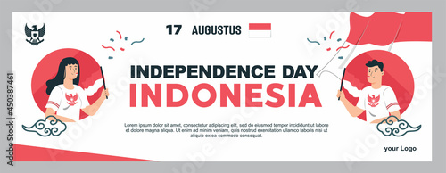 spirit of Indonesian Independence Day. 17 august 2 youths carrying flags celebrated independence day by carrying flags with enthusiasm. Use it for banners, and backgrounds.