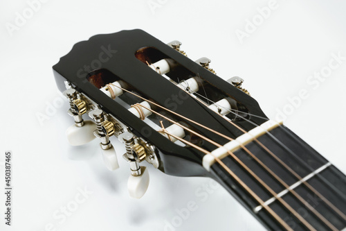 Classical guitar fretboard on white background, guitar © Vladyslav