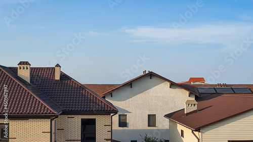 House in the background of nature. Blue sky. Summer landscape.