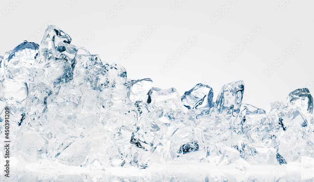 The heap of shiny natural ice cubes on a white background. The heap of shiny natural ice cubes on a white background.