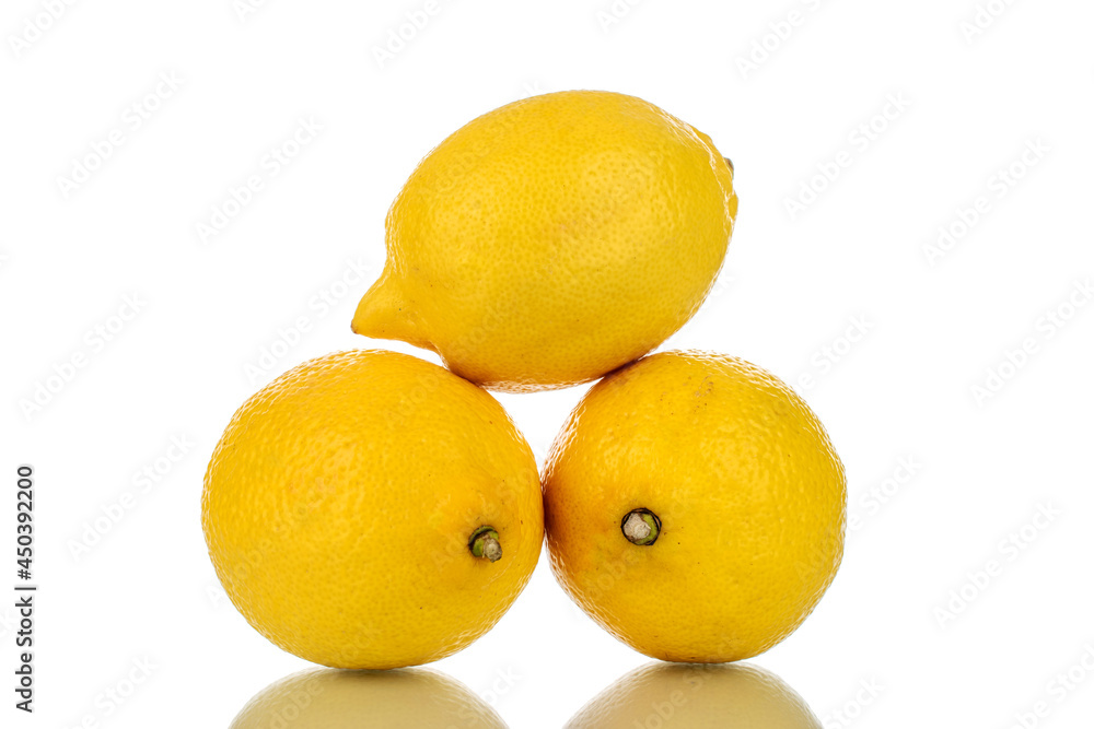Three juicy bright yellow lemons, close-up, isolated on white. Three juicy bright yellow lemons, close-up, isolated on white.