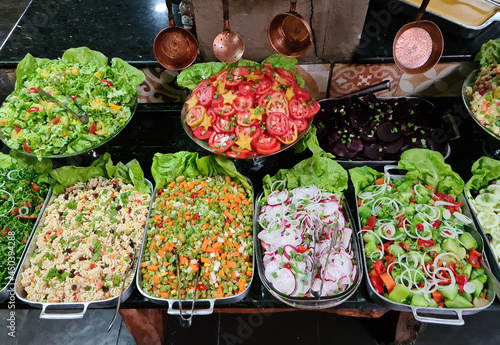 Self-service salad buffet with a variety of products © lcrribeiro33@gmail
