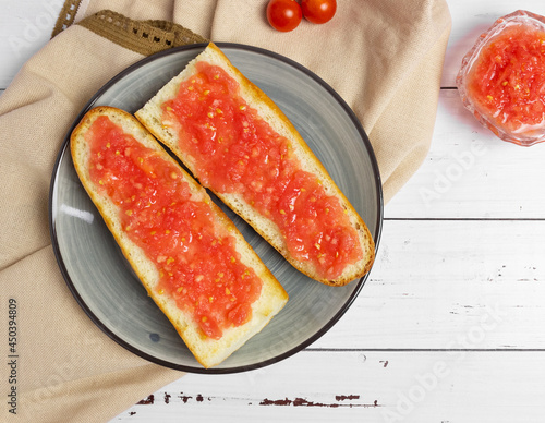 Toast with tomato, traditional Spanish breakfast. Olive oil, top view. Pan tumaka