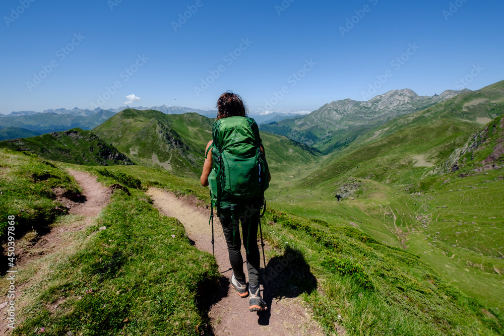 trekker on Tour de l Ossau and Ayous lakes tour, Pyrenees National Park, Pyrenees Atlantiques, France trekker on Tour de l Ossau and Ayous lakes tour, Pyrenees National Park, Pyrenees Atlantiques, France