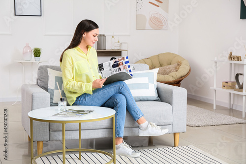 Young woman reading fashion...