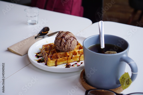 tea and chocolate ice-cream on waffle