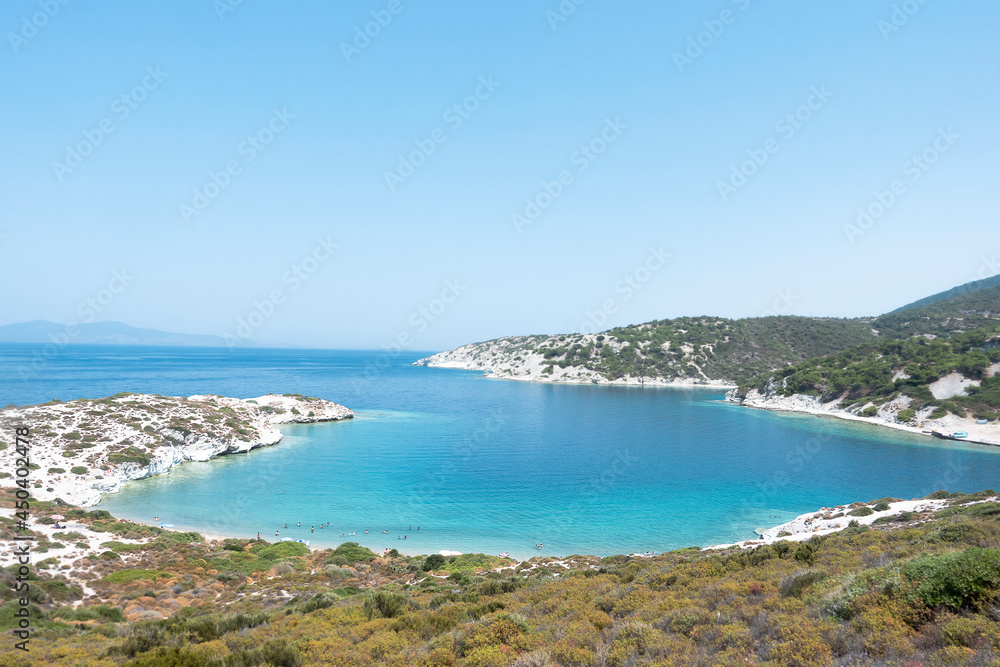 One of the beautiful bays of Foca (Phokaia) town in Izmir, Turkey. Foça is a coastal resort town located in izmir. View of sunny summer day on coastline and blue mediterranean sea.