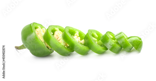 Slices of green jalapeno pepper on white background