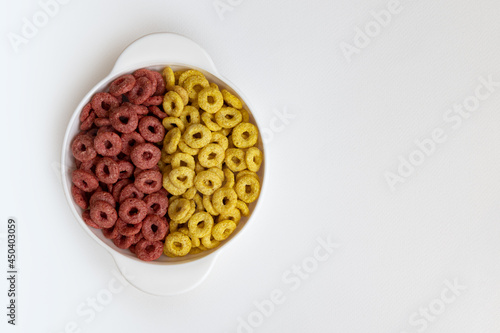bowl of whole whole grain cereal rings breakfast isolated on white background