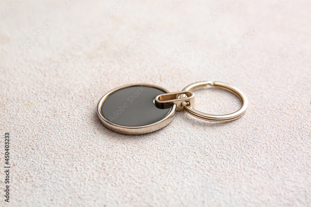 Stylish keychain on light background Stylish keychain on light background