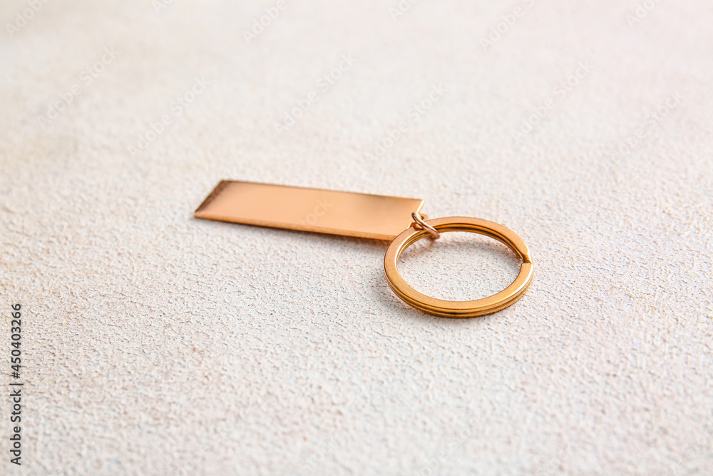 Stylish keychain on light background Stylish keychain on light background