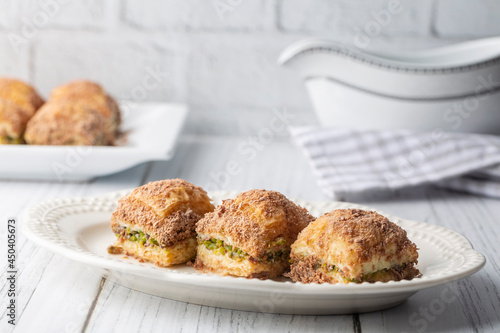 Traditional turkish new dessert cold milky baklava with pistachio (Turkish name; soguk baklava) photo