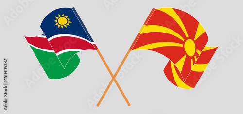 Crossed and waving flags of Namibia and North Macedonia