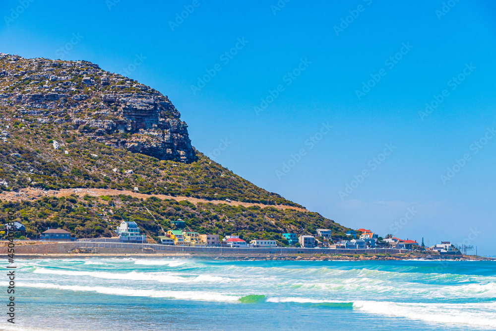 Fish Hoek Beach at False Bay turquoise water Cape Town.
