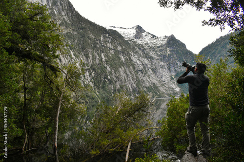person photographing on a mountain