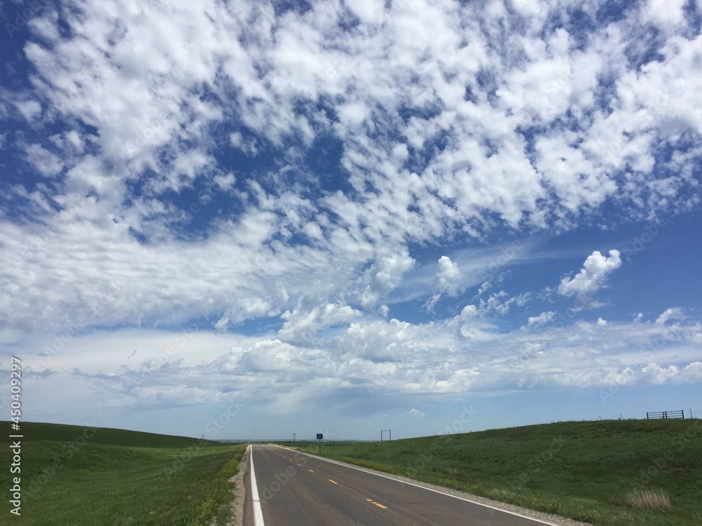 Flint Hills of Kansas. US Highway 177 with altocumulus in sky above. Flint Hills of Kansas. US Highway 177 with altocumulus in sky above.