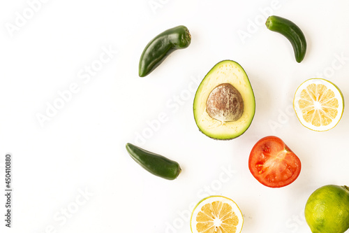 Conceptual photo made of avocado, lemon and tomato